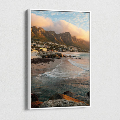 Vertical canvas wall art of mountains, beach waves, and colorful sunset sky.