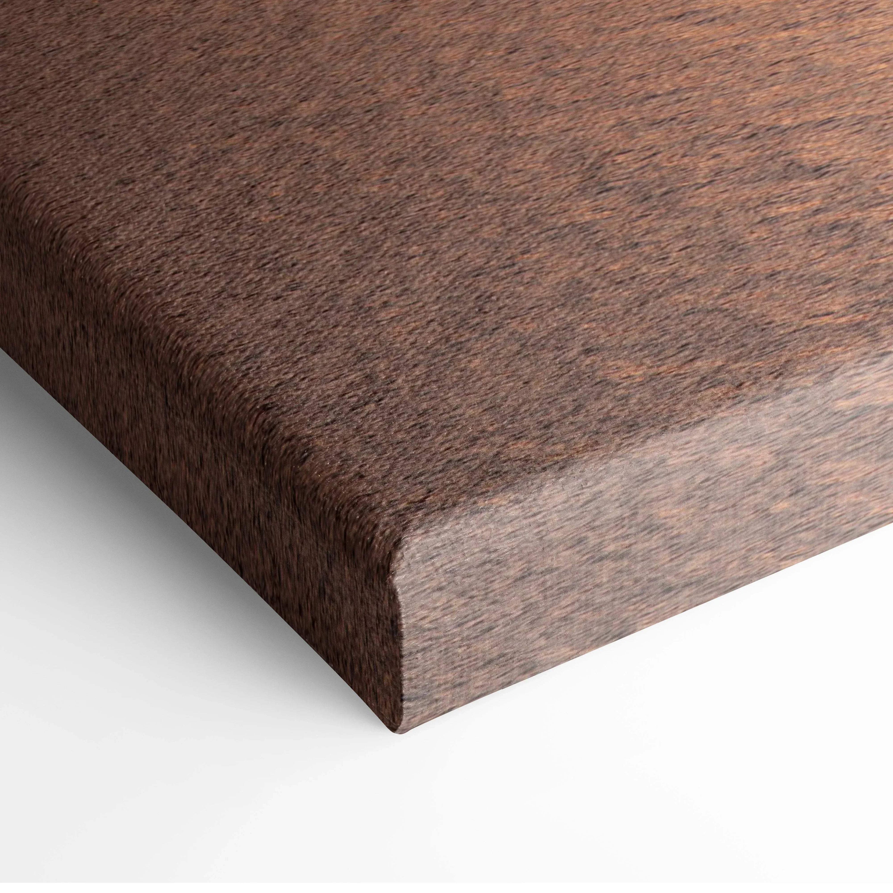 Close-up of canvas wall art corner with detailed mountain sunset texture and warm color tones.