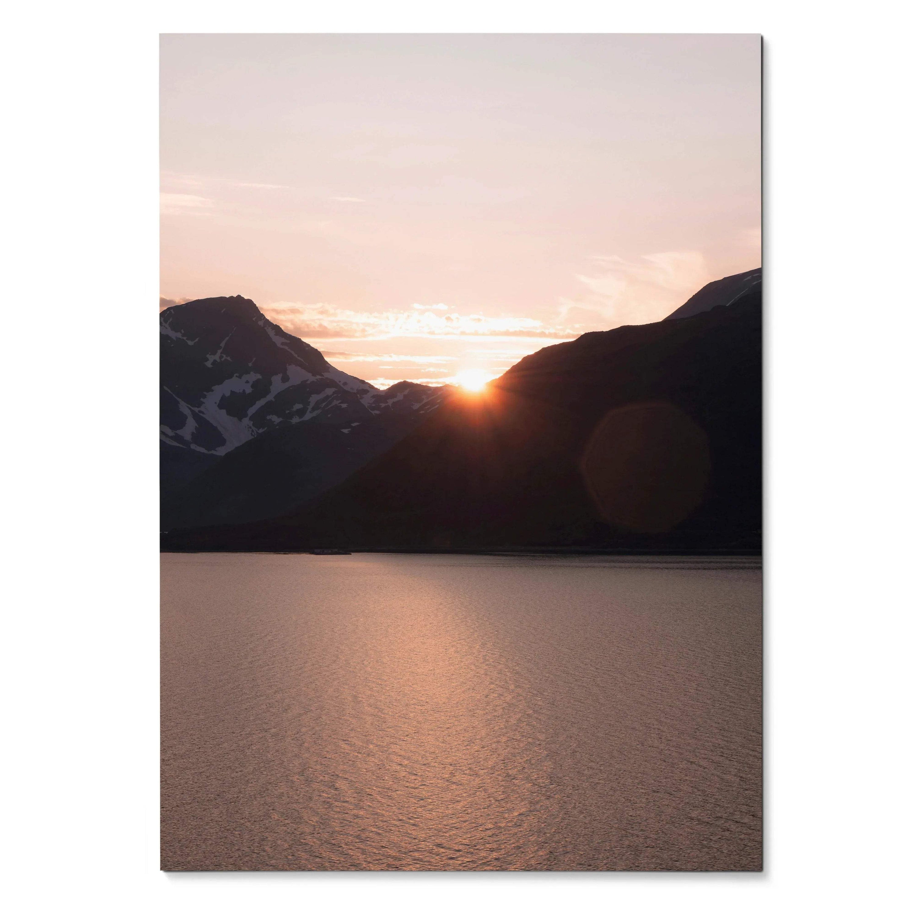 Sunset over mountain silhouettes reflecting on calm water poster wall art.