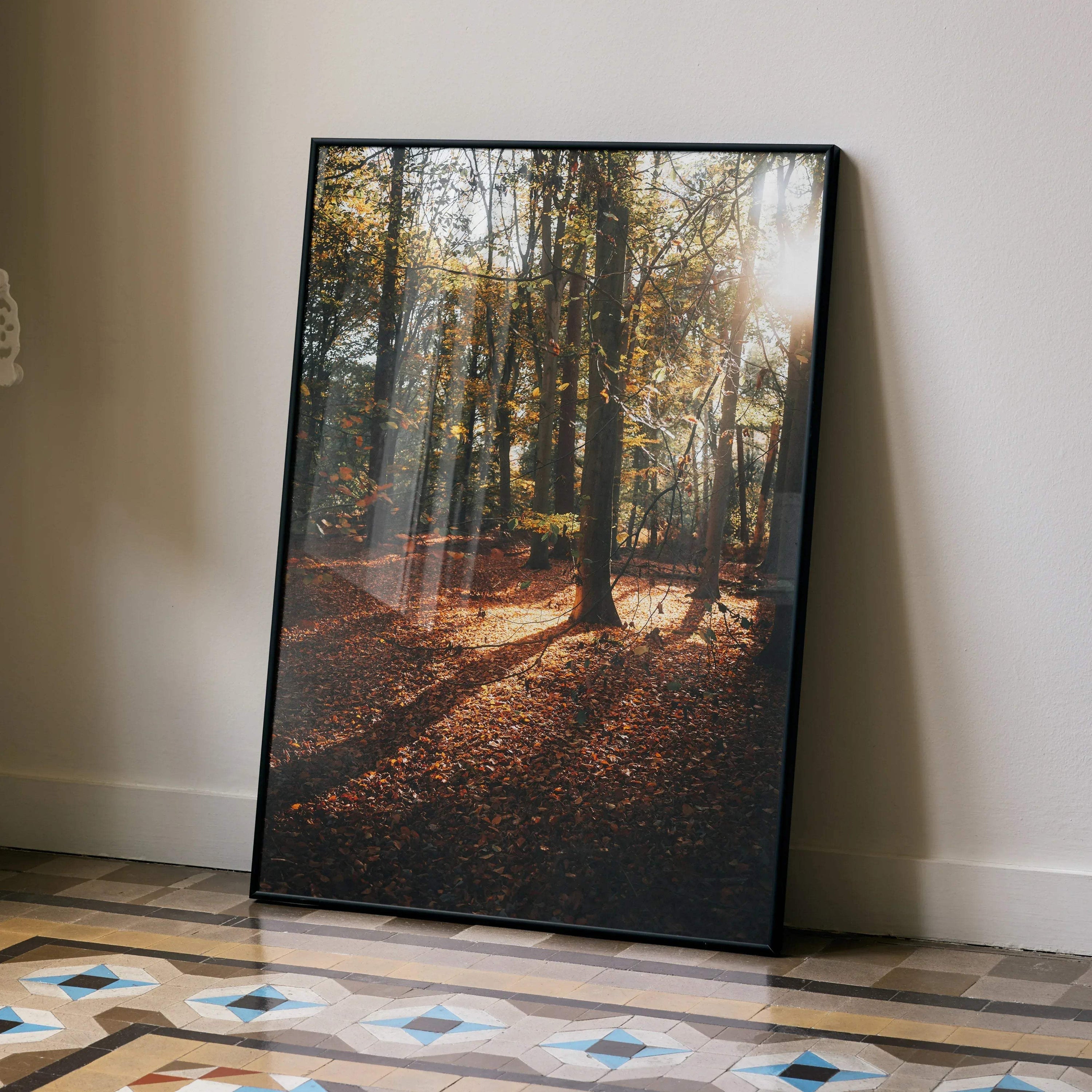 Vertical autumn forest poster with sunlit trees and fallen leaves, vibrant wall art.