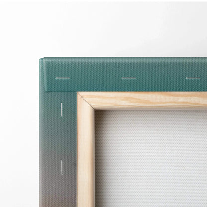 Close-up of wooden frame and textured canvas corner of vertical wall art print.