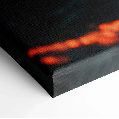 Close-up of canvas wall art corner showing ocean sunset colors with textured surface.