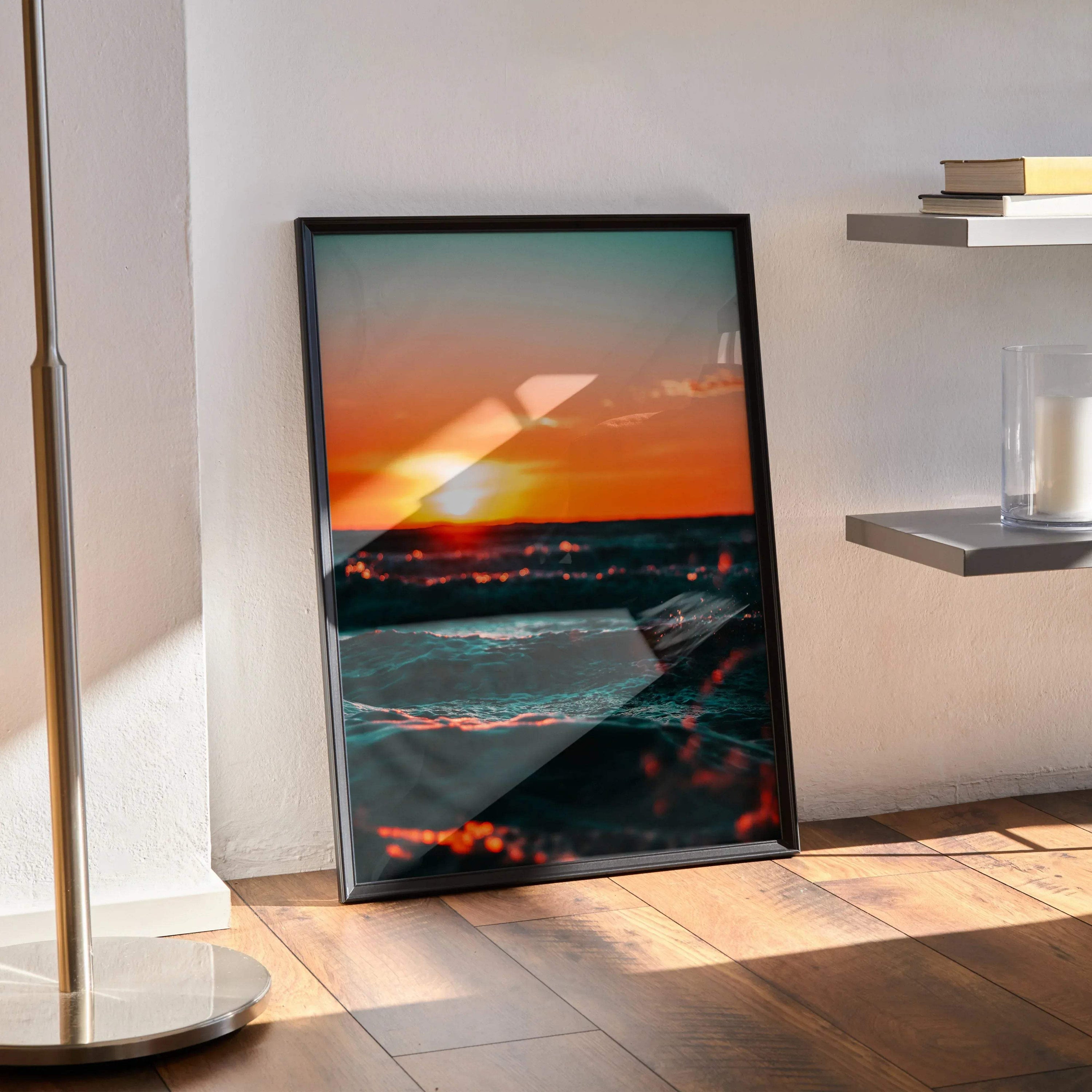 Ocean sunset nature art poster with vibrant orange sky and calm waves, framed vertical wall art.