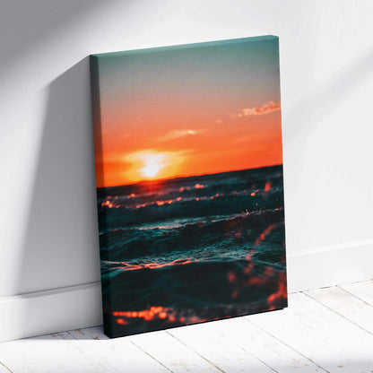 Majestic ocean sunset with glowing orange sky and dark waves on canvas wall art.