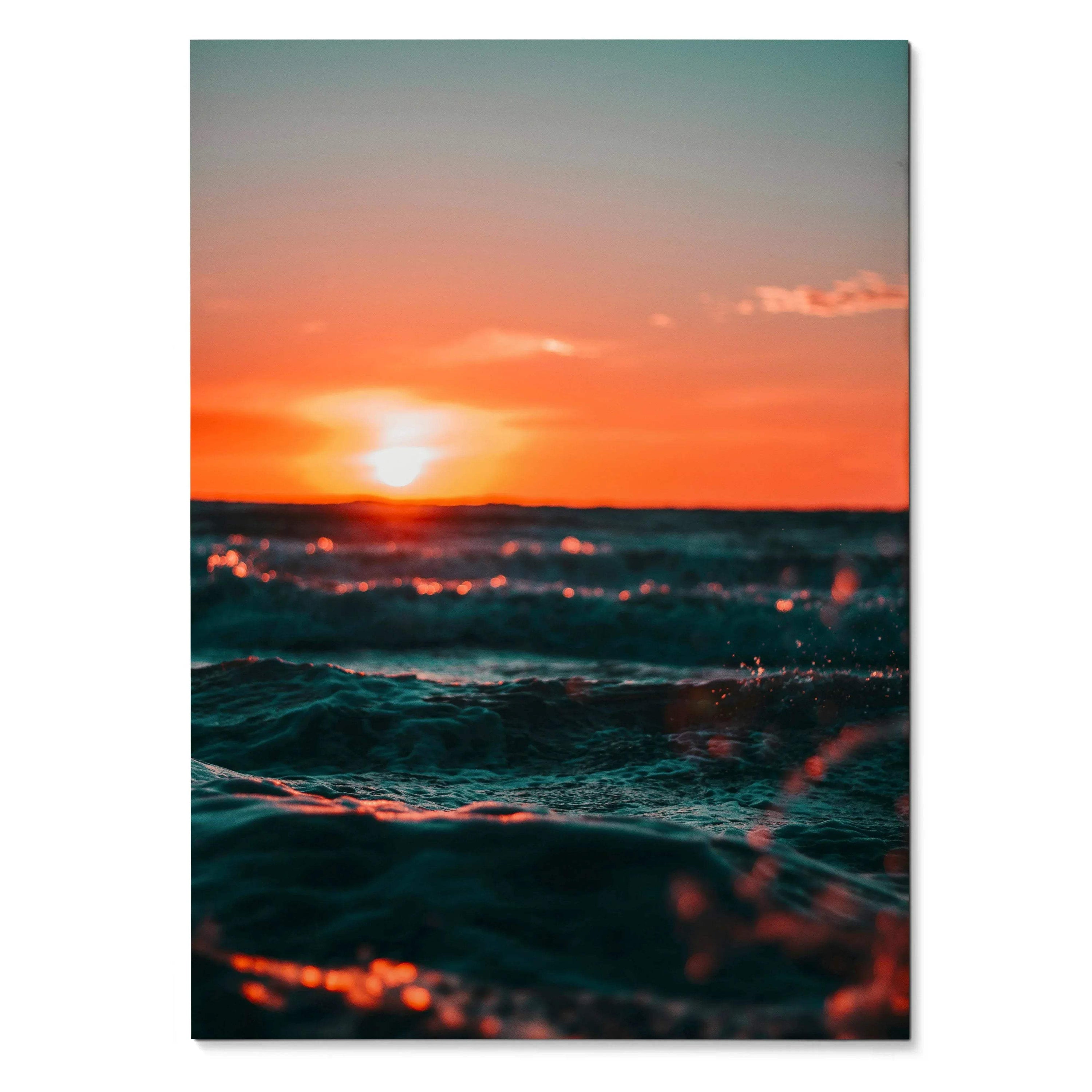 Ocean sunset poster featuring vibrant orange sky and deep blue waves, vertical wall art.