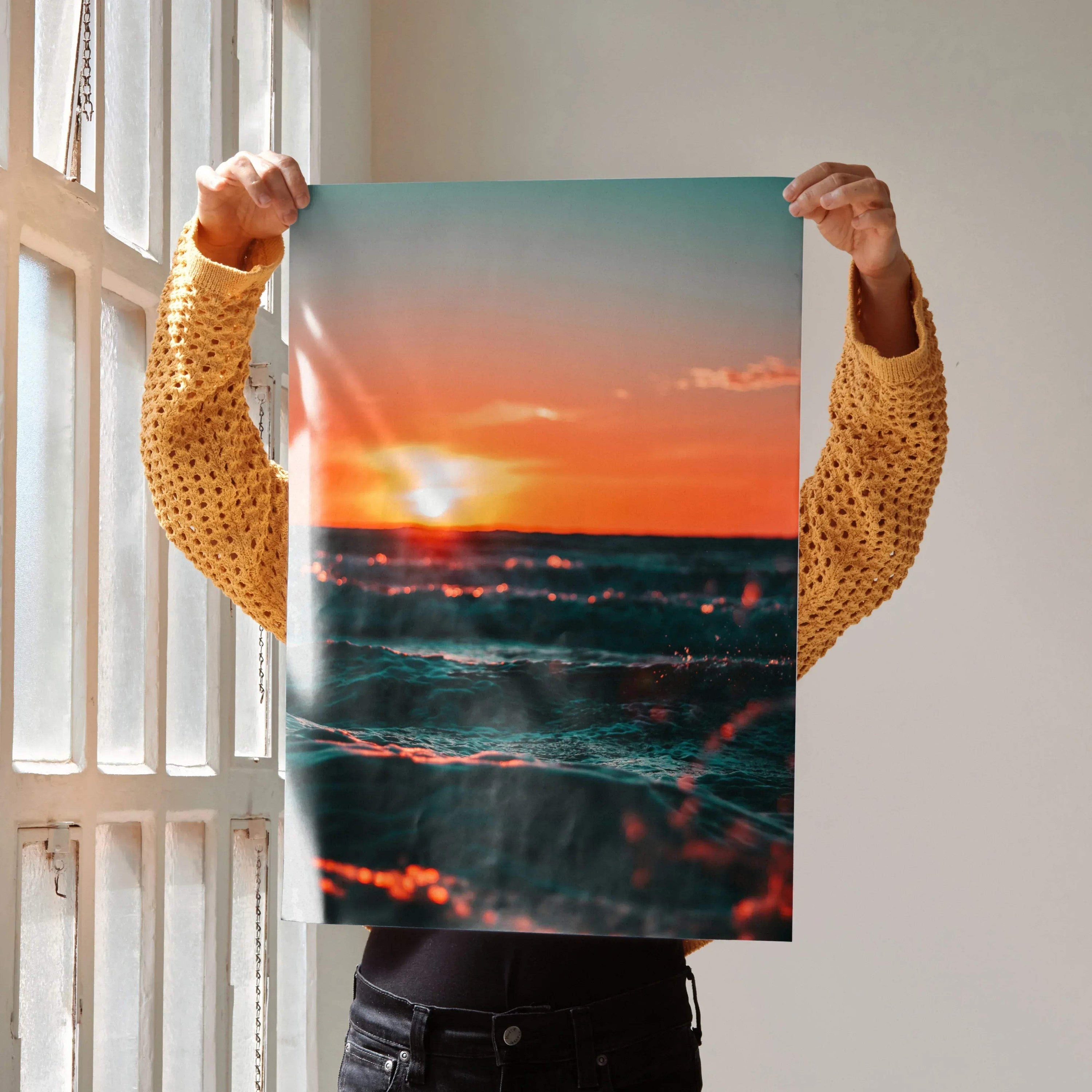 Ocean sunset poster with vibrant red and orange sky over dark waves, vertical wall art.