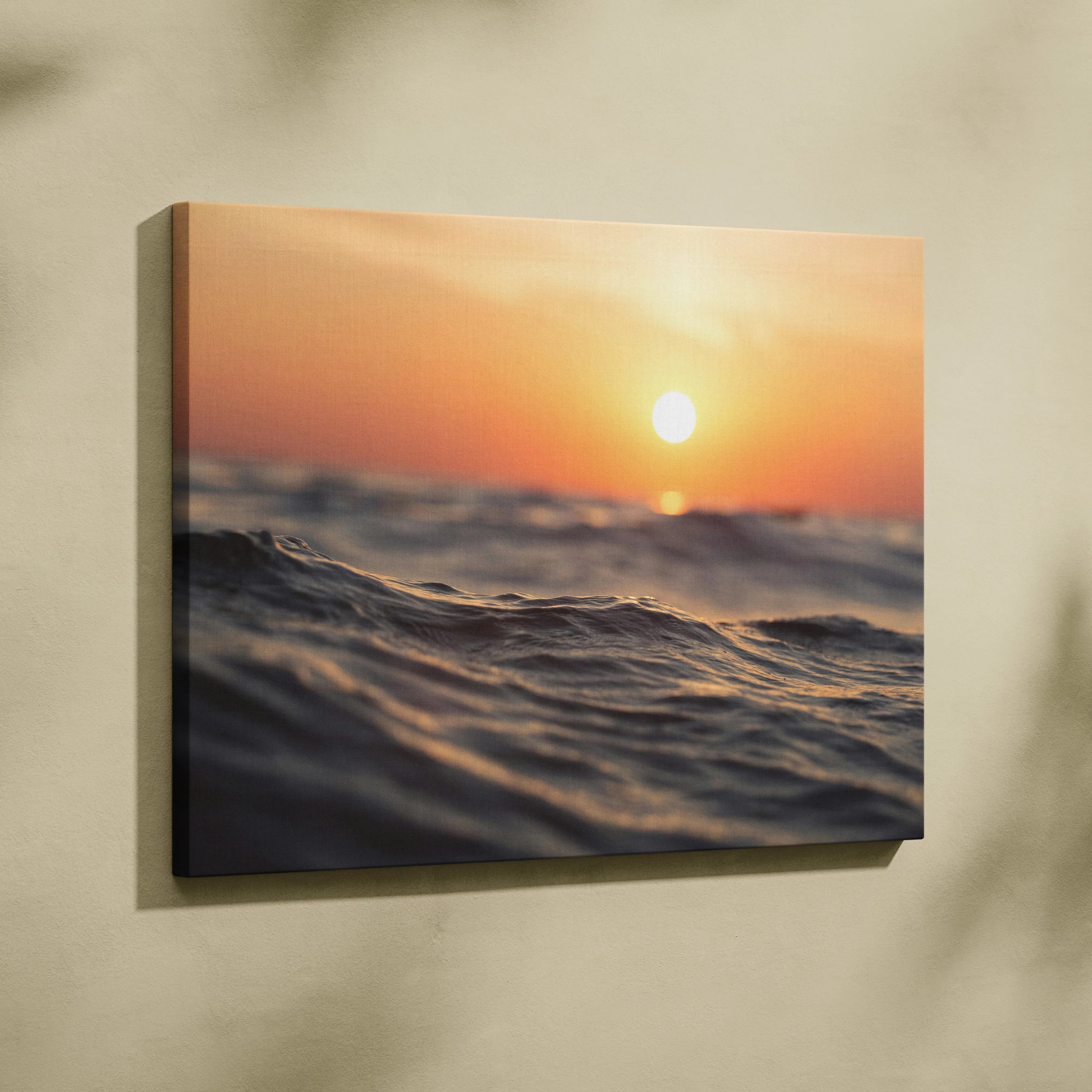 Sunset ocean waves canvas wall art with warm orange sky and glowing sun.