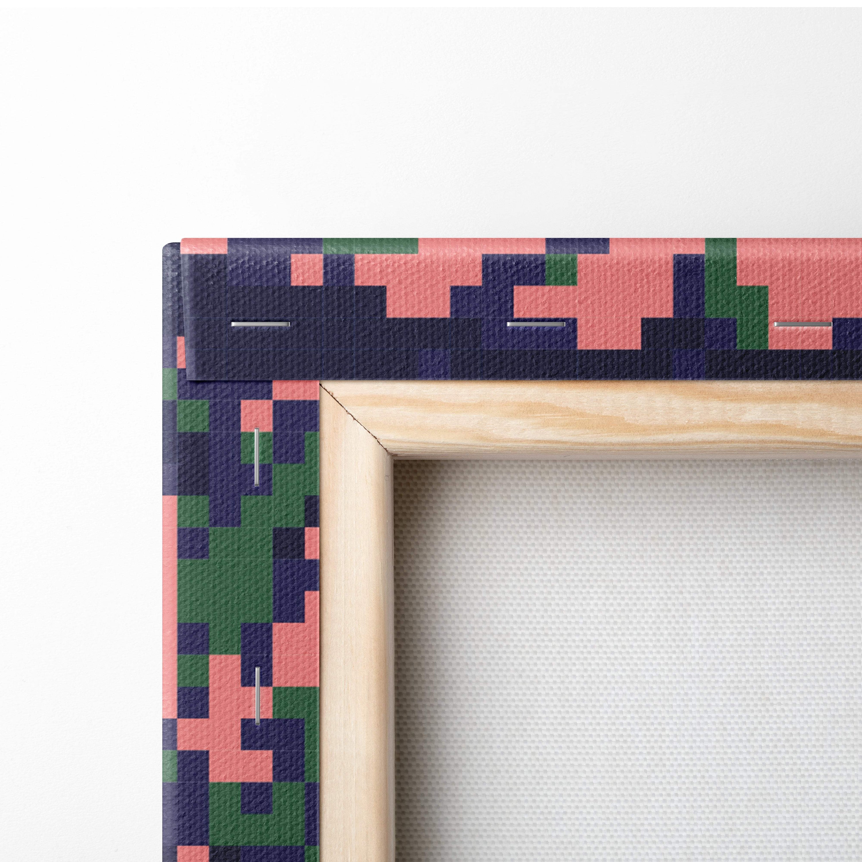 A wooden canvas frame with pixelated pink green and navy blue camouflage for tropical beach pixel art decor