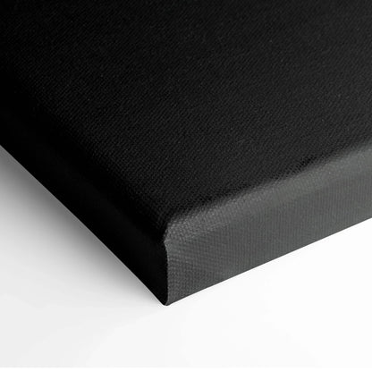 Black stretched canvas corner showing texture and cleanly wrapped edge for wall art.