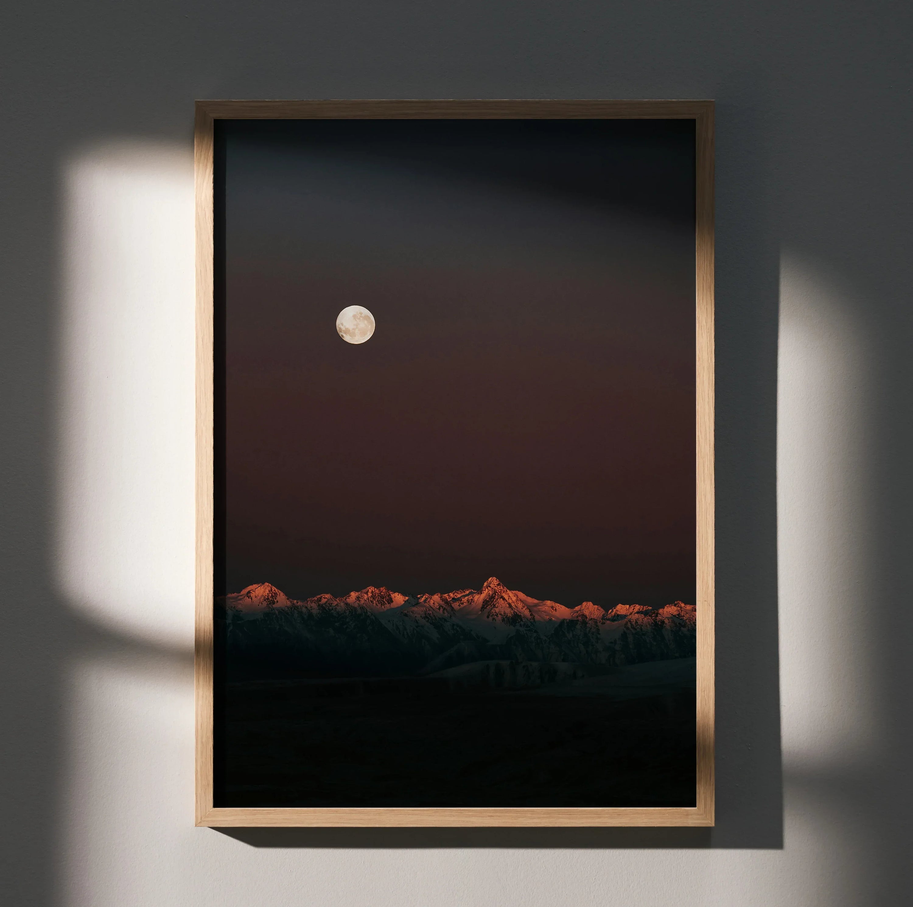 Vertical wall art poster featuring dusk mountains under a glowing full moon with dark sky.