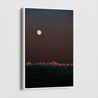 Vertical canvas wall art featuring a dark mountain landscape under a full moon at night.
