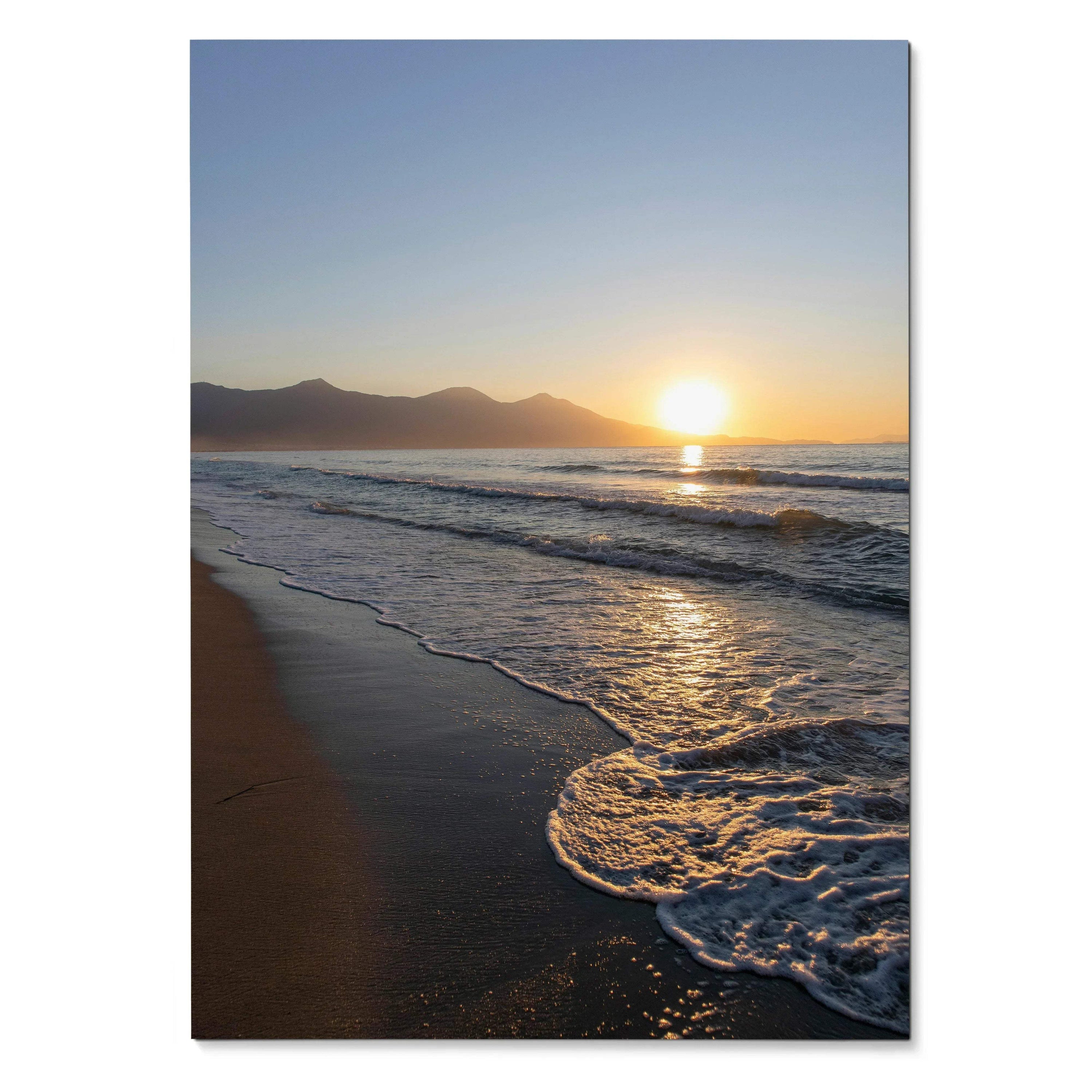Vertical beach sunset poster with glowing sun, gentle waves, and distant mountains wall art.