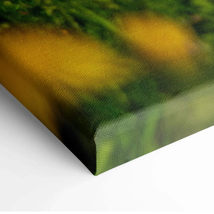 Close-up of canvas wall art corner showing detailed texture and vibrant green and yellow floral mountain design.
