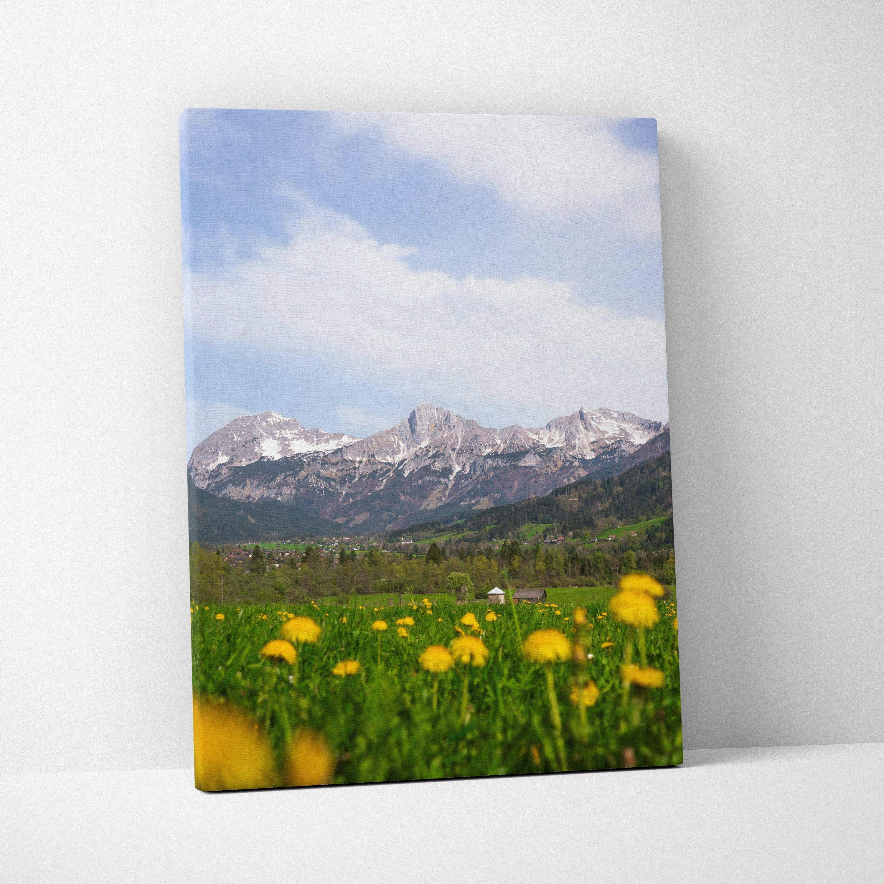 Canvas wall art featuring yellow wildflowers with snow-capped mountains under a blue sky.