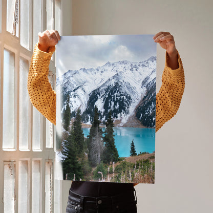 Vertical poster of majestic snow-capped mountains with blue lake and evergreen trees wall art.