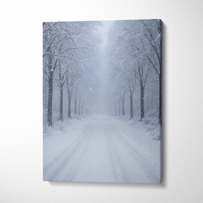 Canvas wall art of a snowy landscape with frosted trees lining a snow-covered road in soft blue tones.