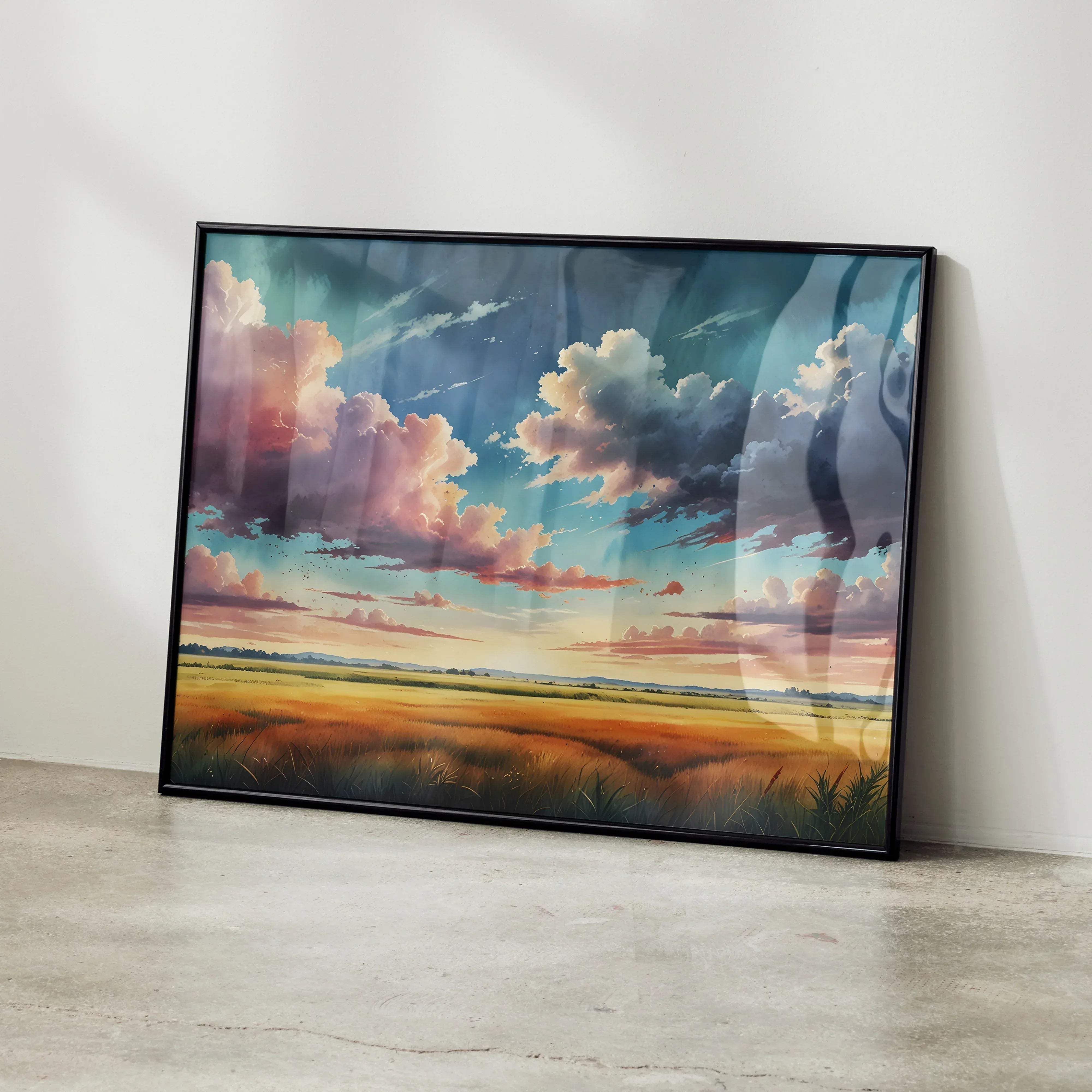 Black-framed canvas print of a colorful watercolor styled sunset over a golden field with pink and blue clouds wall art poster