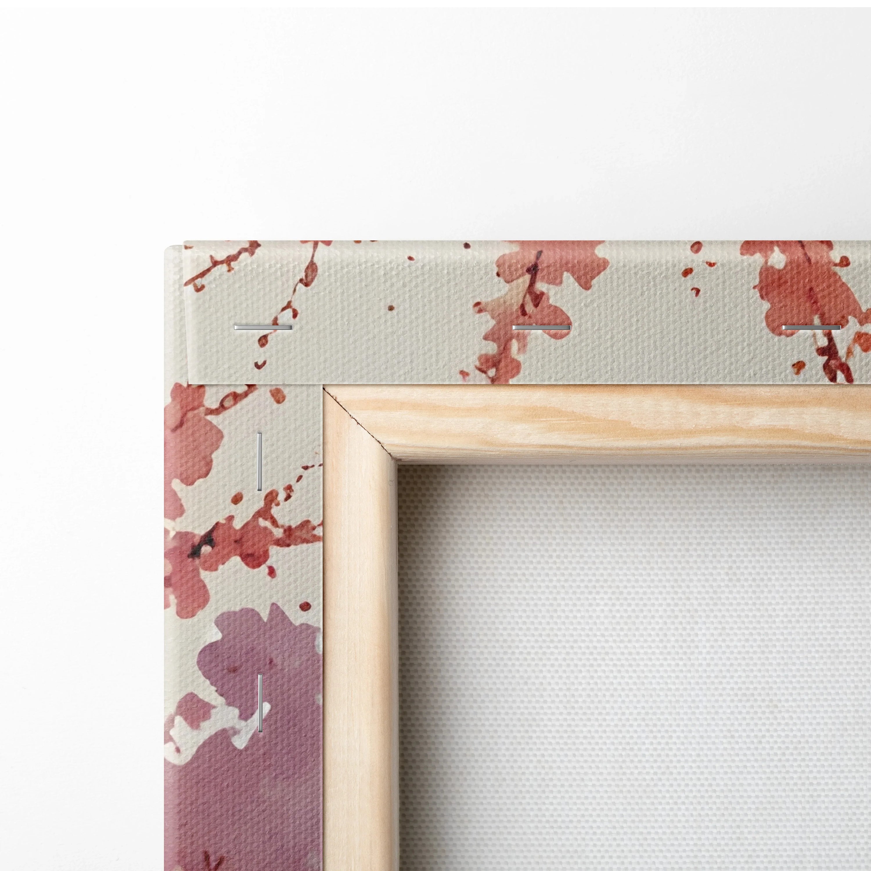 Close-up of wooden frame corner on cherry blossom watercolor canvas wall art with soft pink tones.