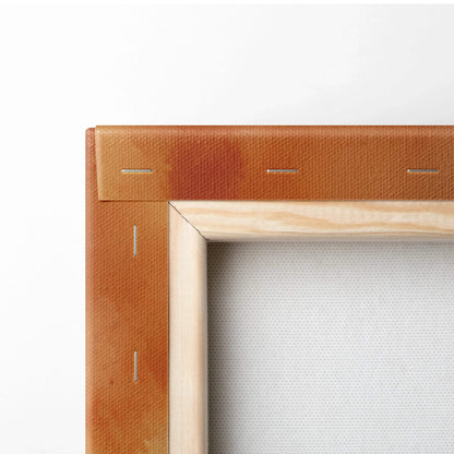 Close-up of canvas wall art corner with natural wood frame and warm brown leather outer edging.