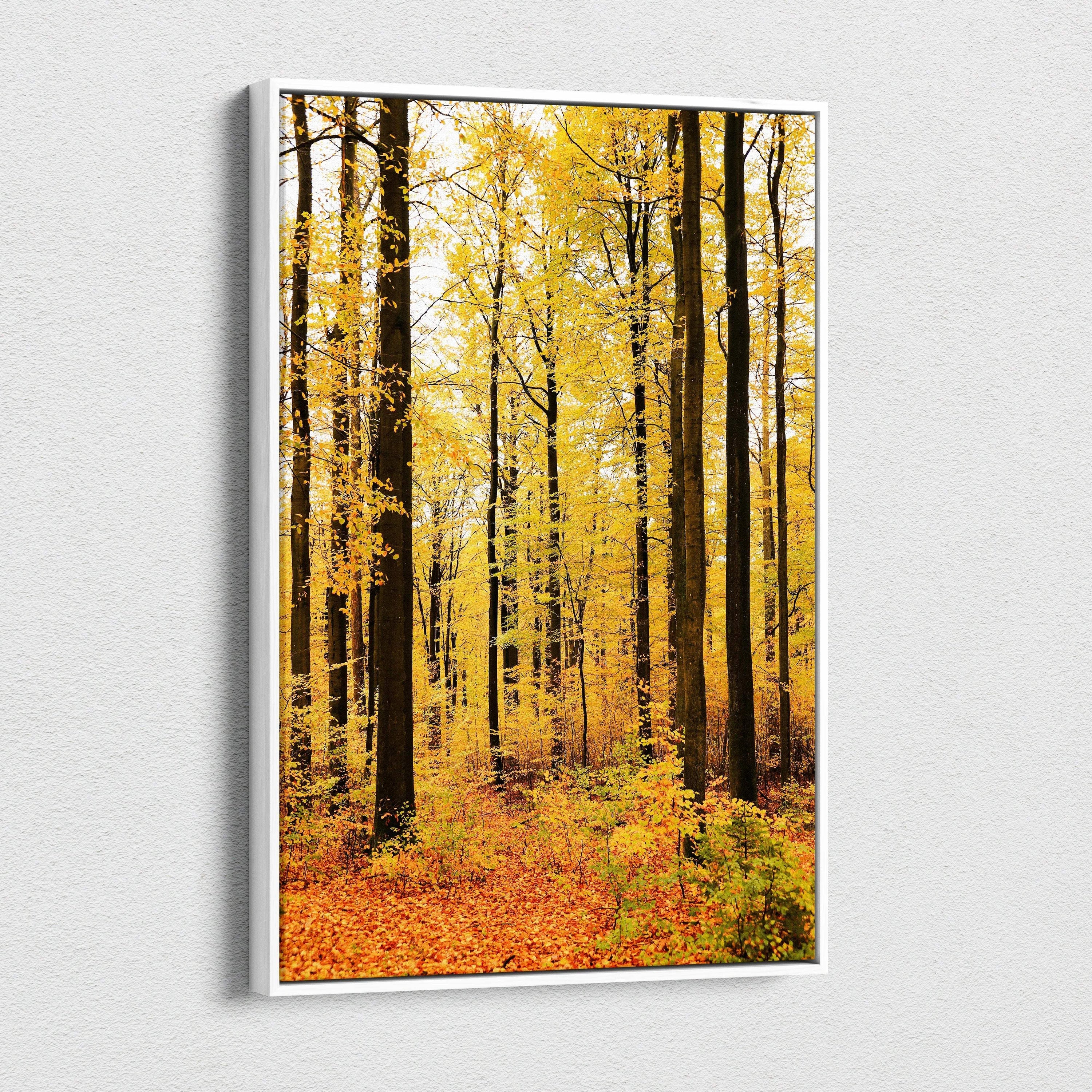 Vertical canvas wall art featuring a golden autumn woodland scene with tall trees and vibrant fall foliage.