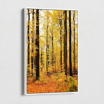 Vertical canvas wall art featuring a golden autumn woodland scene with tall trees and vibrant fall foliage.