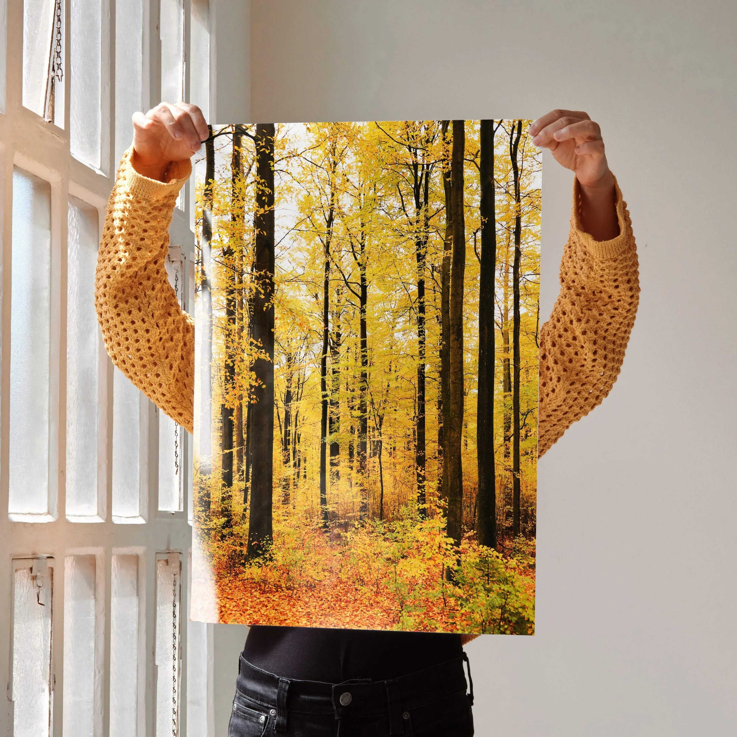 Vertical autumn forest poster with yellow leaves and tall black tree trunks wall art.
