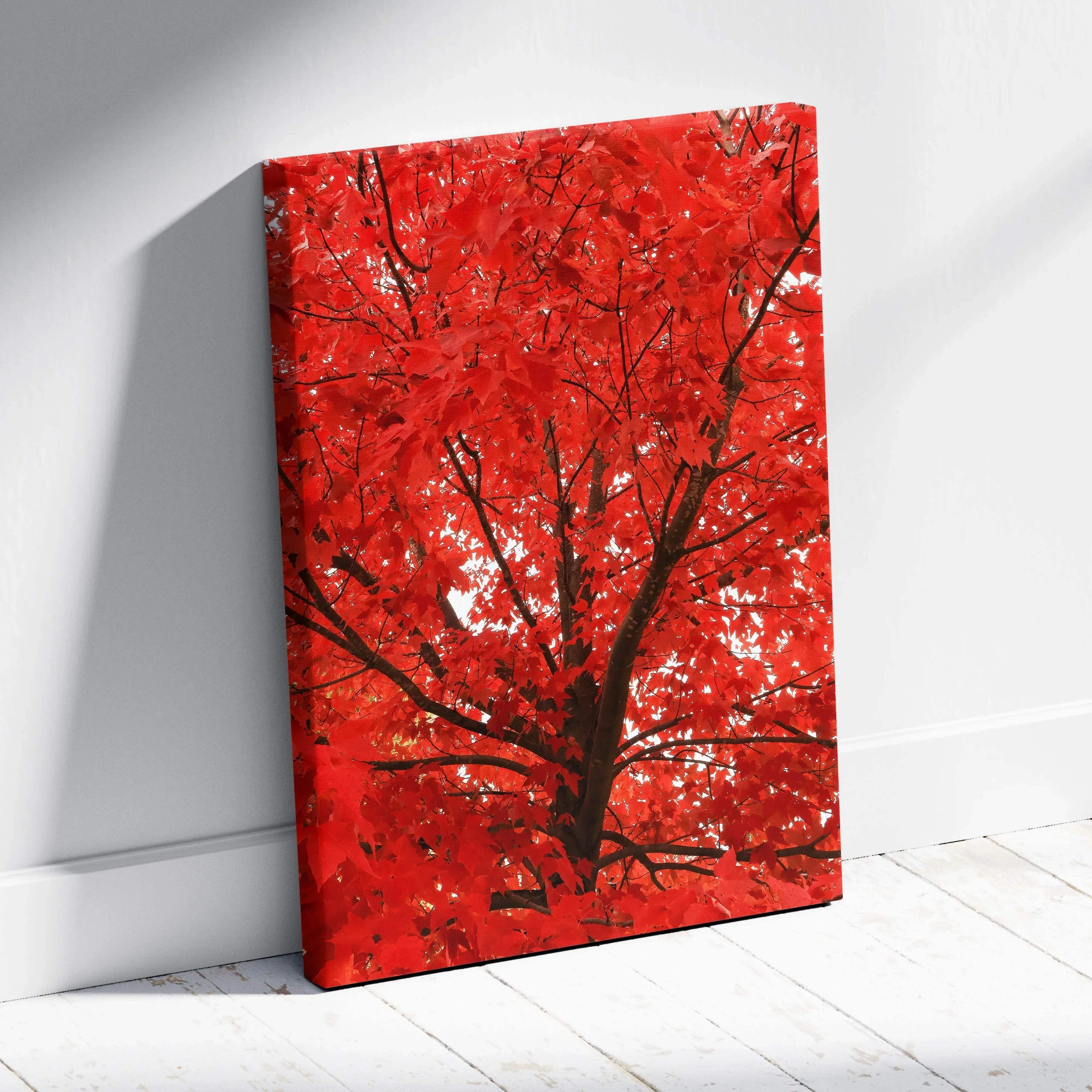 Vertical canvas wall art featuring vibrant red autumn leaves on a tree against a bright sky.