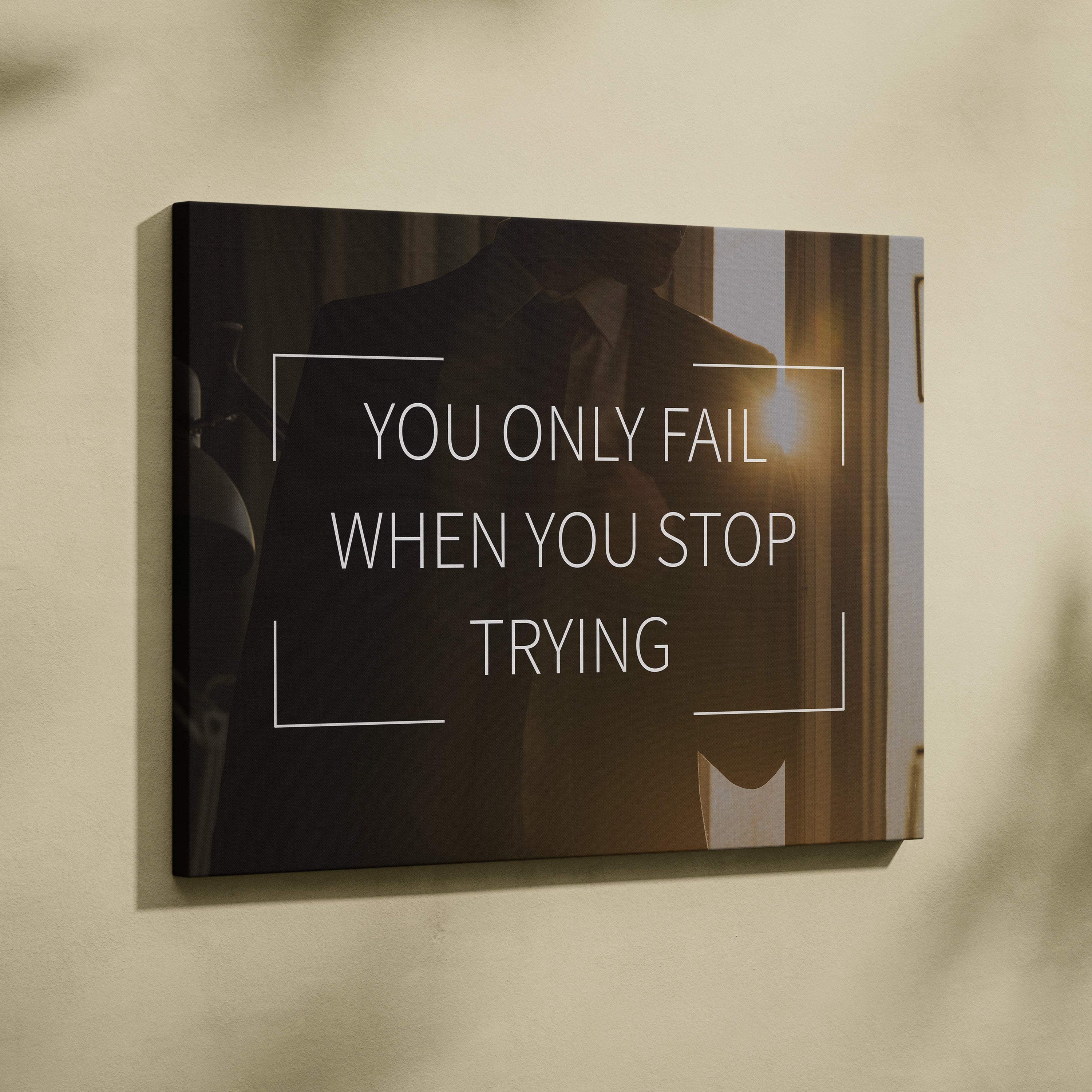 Black canvas wall art with white motivational quote you only fail when you stop trying featuring minimalist lines on dark background