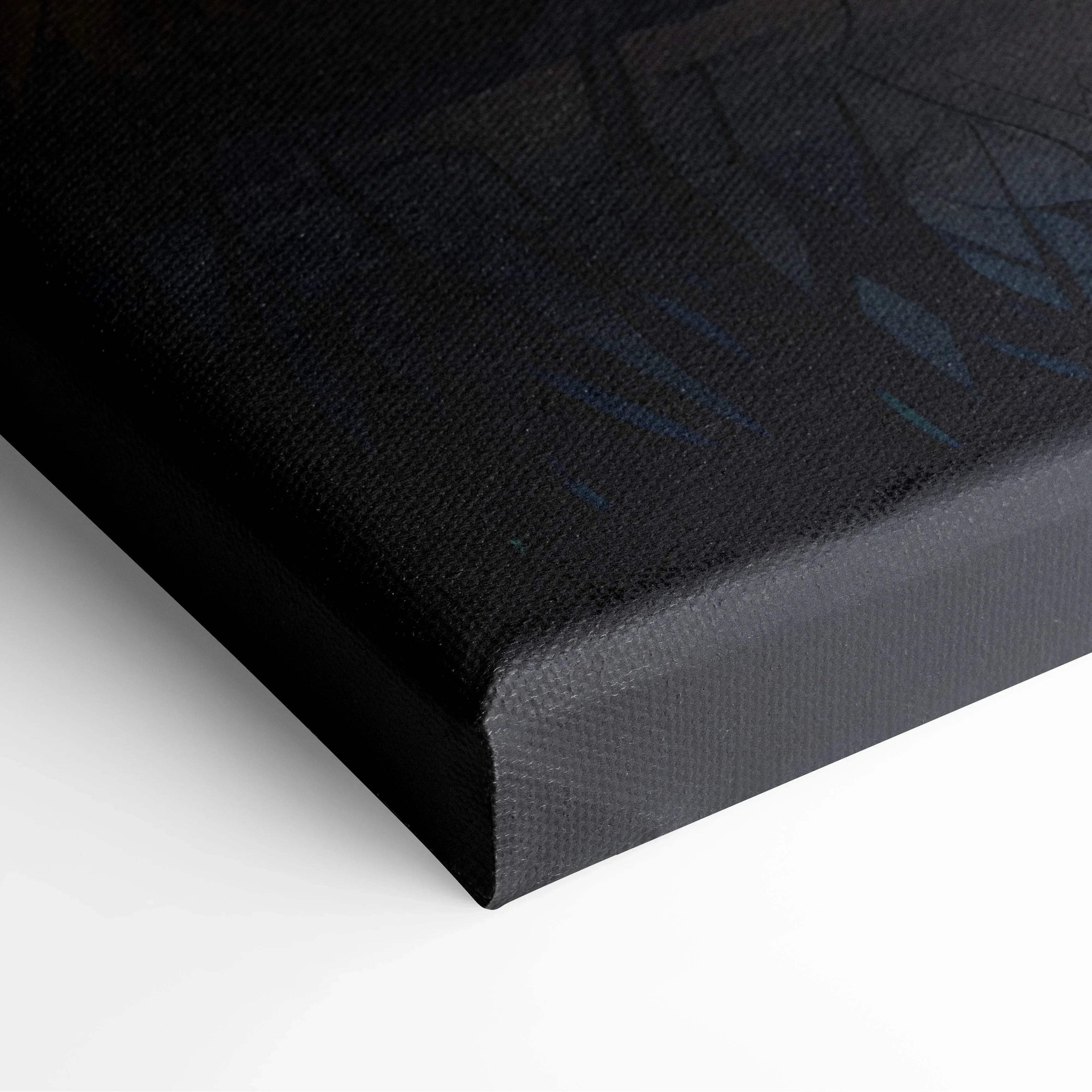 Close-up of dark watercolor canvas wall art featuring subtle night sky design with shades of black and blue on textured.