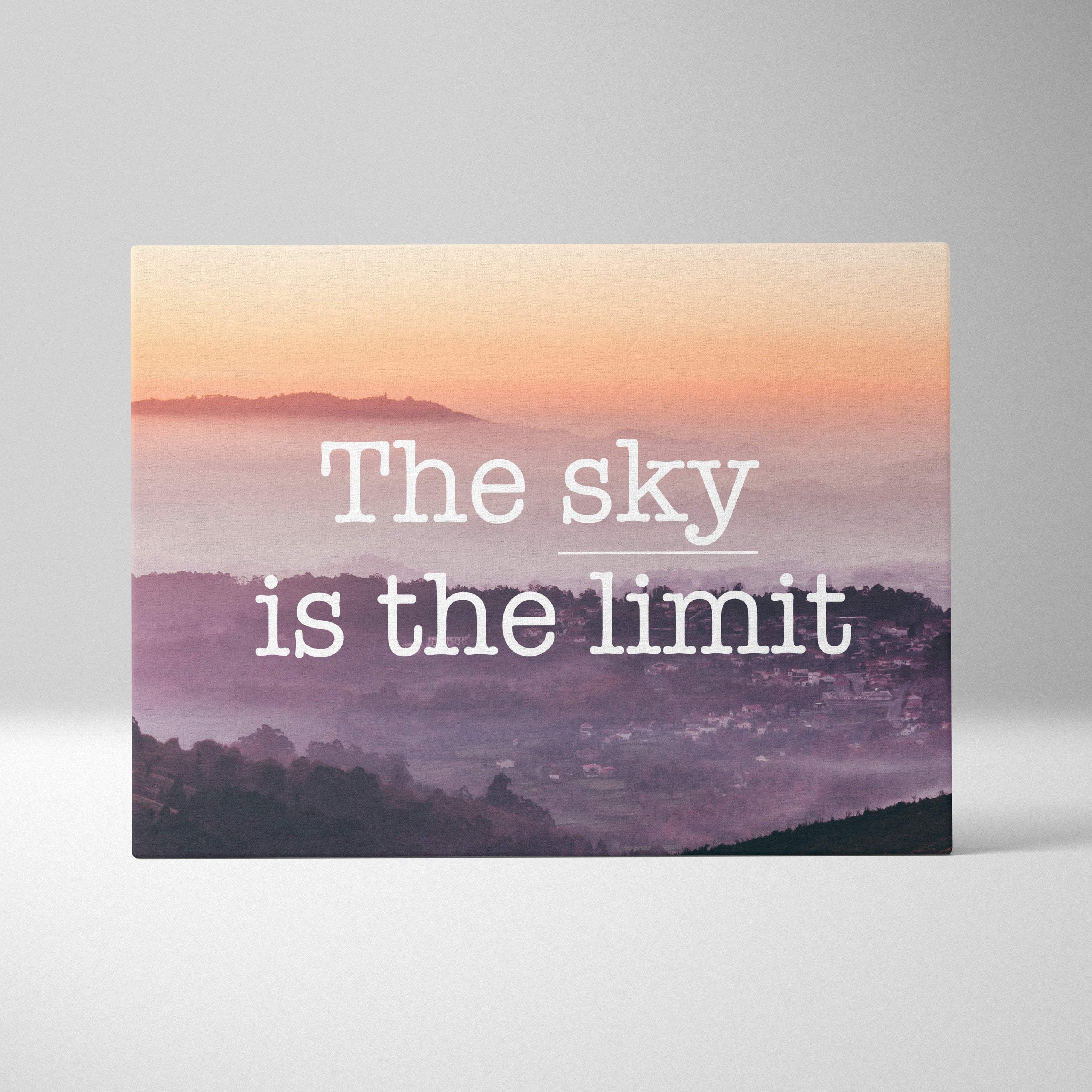 Rectangular canvas print of a misty mountain landscape at sunrise with pink and purple hues featuring an inspirational quote
