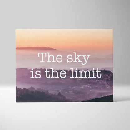 Rectangular canvas print of a misty mountain landscape at sunrise with pink and purple hues featuring an inspirational quote