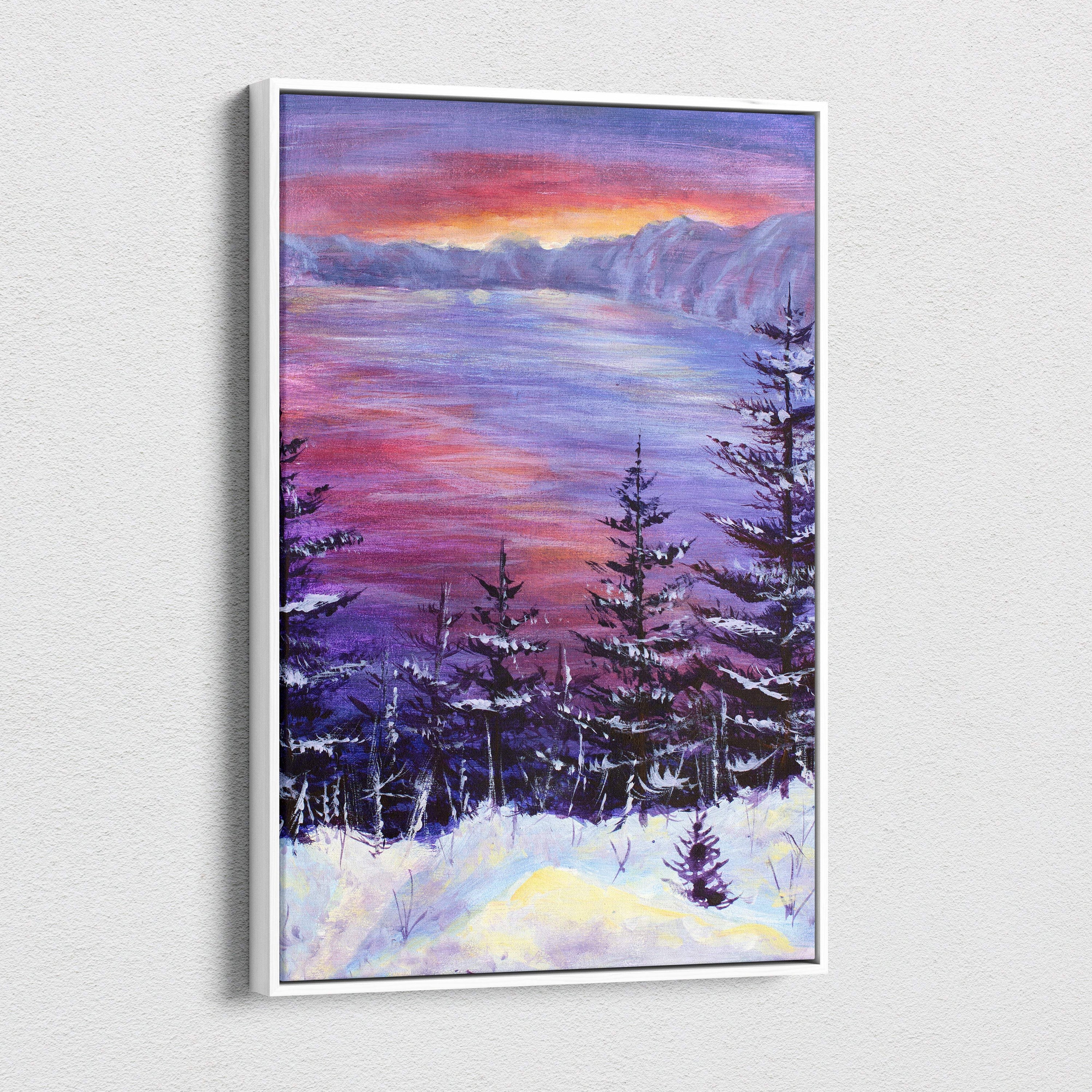 A framed canvas print of a snowy forest landscape with frosted pine trees under a purple and orange sunset sky