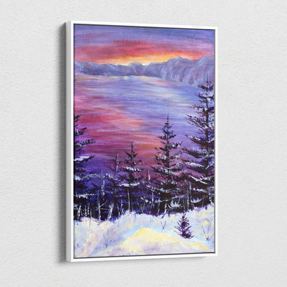 A framed canvas print of a snowy forest landscape with frosted pine trees under a purple and orange sunset sky