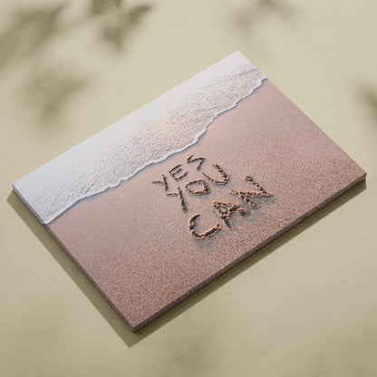 Beige canvas print featuring textured beach scene with white foam and yes you can etched in sand motivational wall art