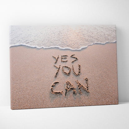 Beige canvas print with yes you can written in sand and a gentle wave, motivational coastal wall art decor