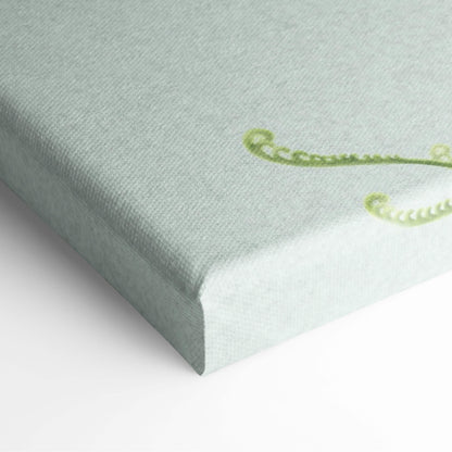 A light green canvas print with delicate swirling vine patterns in darker green from contemporary cracked stone face wall art