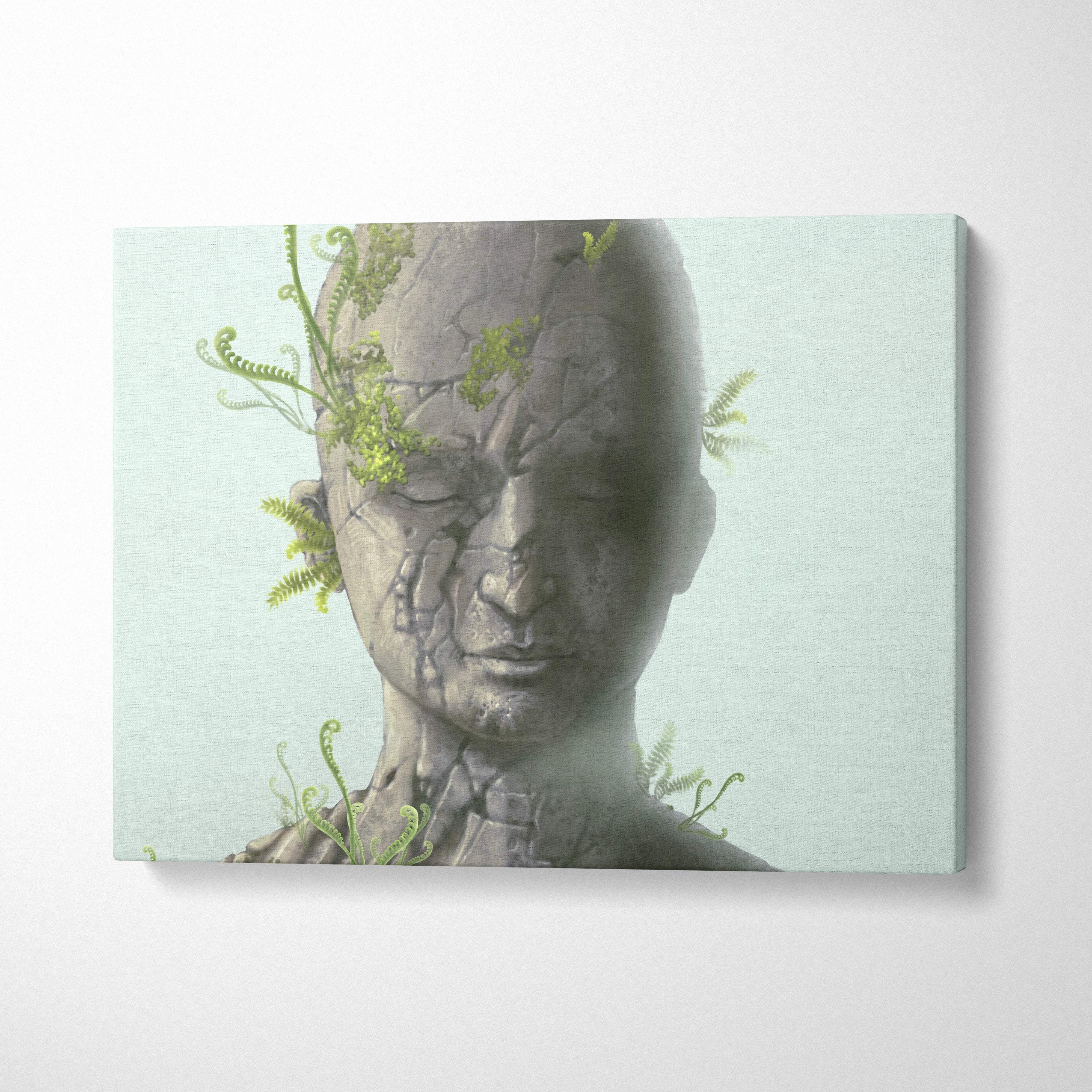 Contemporary cracked stone face canvas wall art with gray portrait and green ferns for modern zen decor