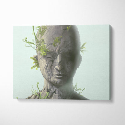 Contemporary cracked stone face canvas wall art with gray portrait and green ferns for modern zen decor