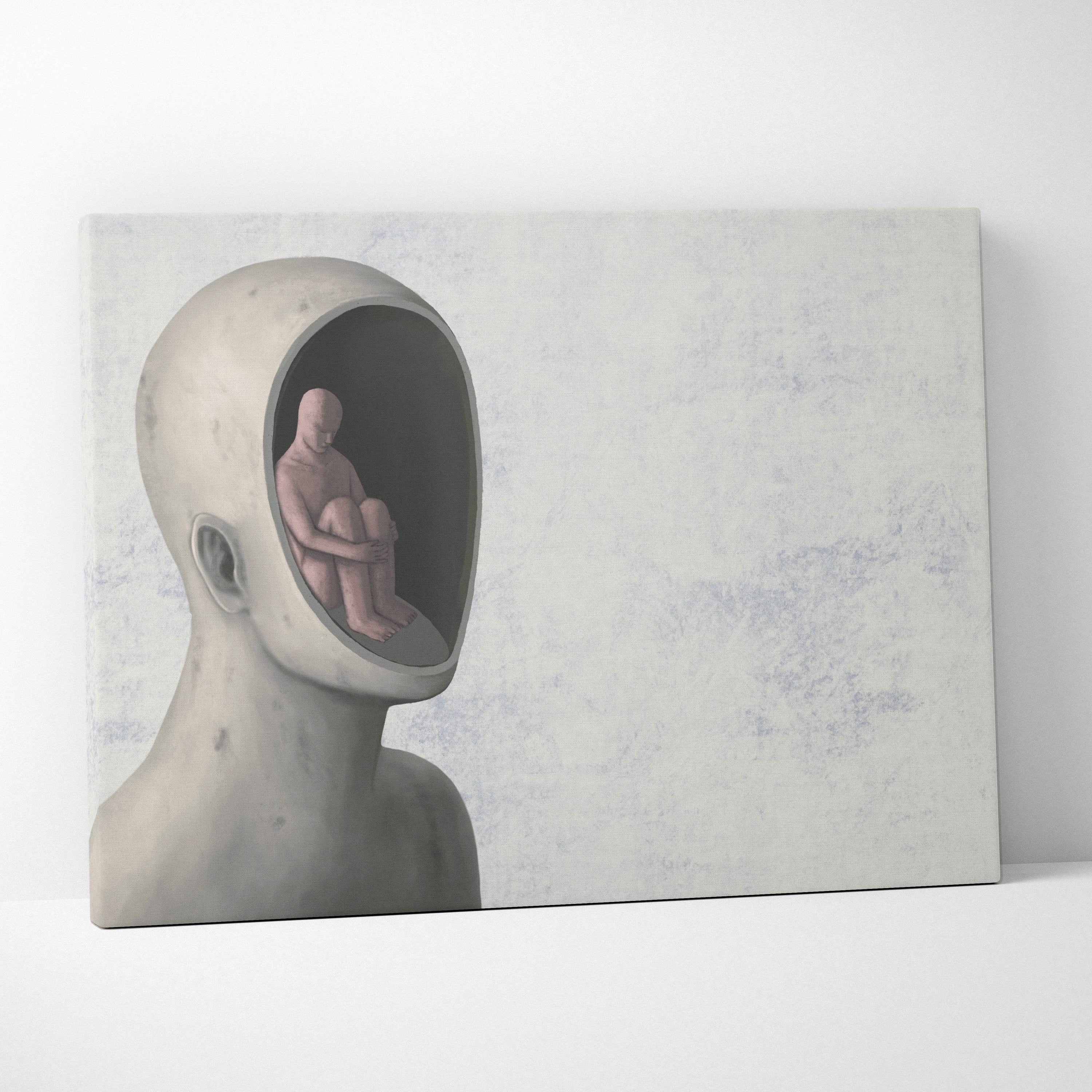 Contemporary inner self canvas wall art featuring a gray surreal head portrait with a seated figure inside for office decor