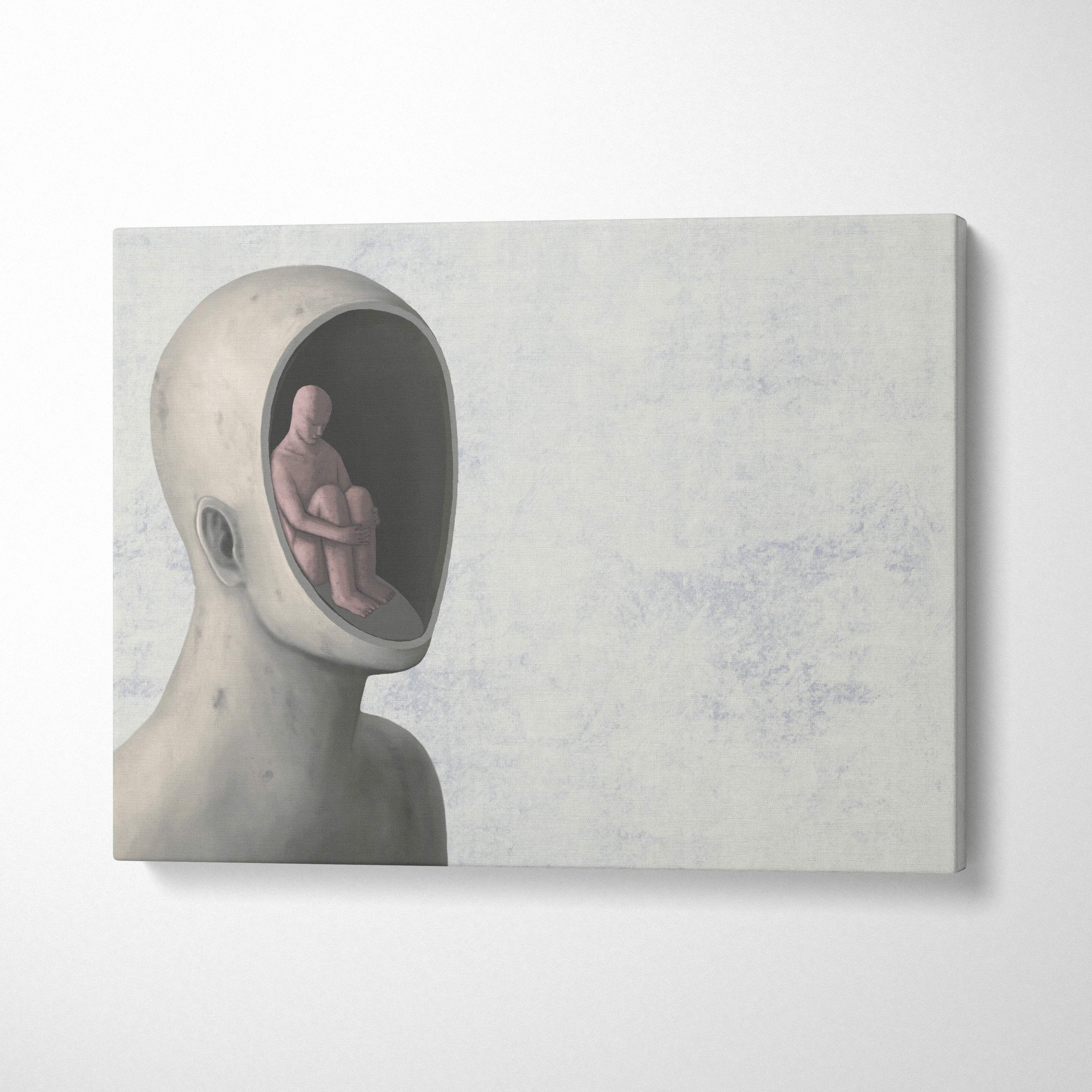 Contemporary gray canvas wall art featuring a minimalist sculpted head with a seated figure inside for office decor