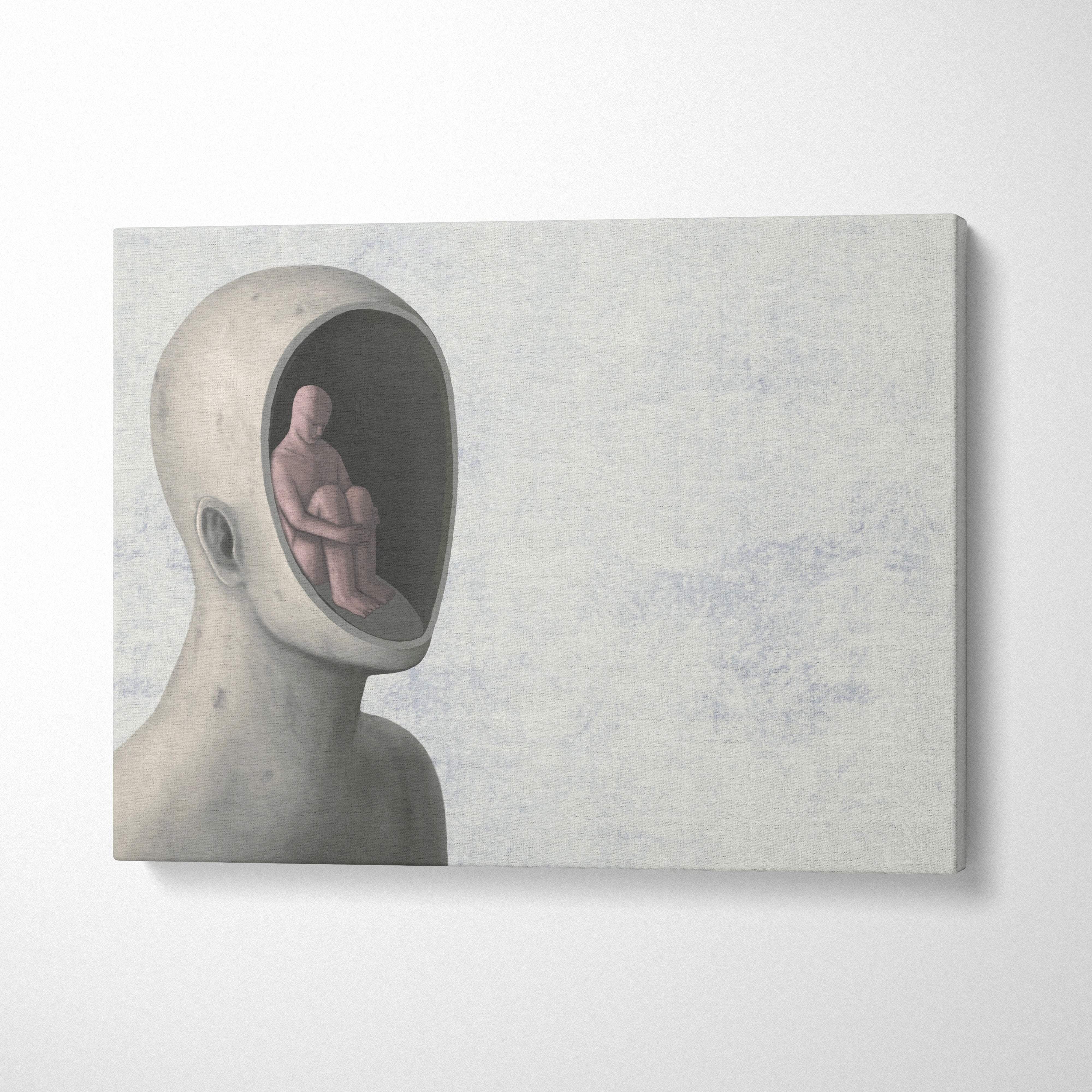 Contemporary gray canvas wall art featuring a minimalist sculpted head with a seated figure inside for office decor