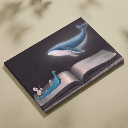 Rectangular canvas print featuring a whimsical blue whale swimming above an open book with a small boat figure