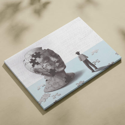 Gray puzzle-piece bust canvas print with man walking away from fragmented head for modern psychology decor
