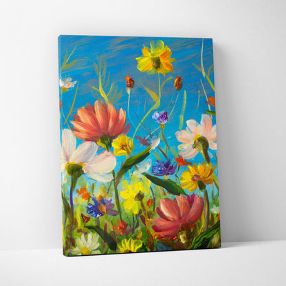 Colorful wildflower meadow canvas print with vibrant pink yellow and purple blossoms against a bright blue sky