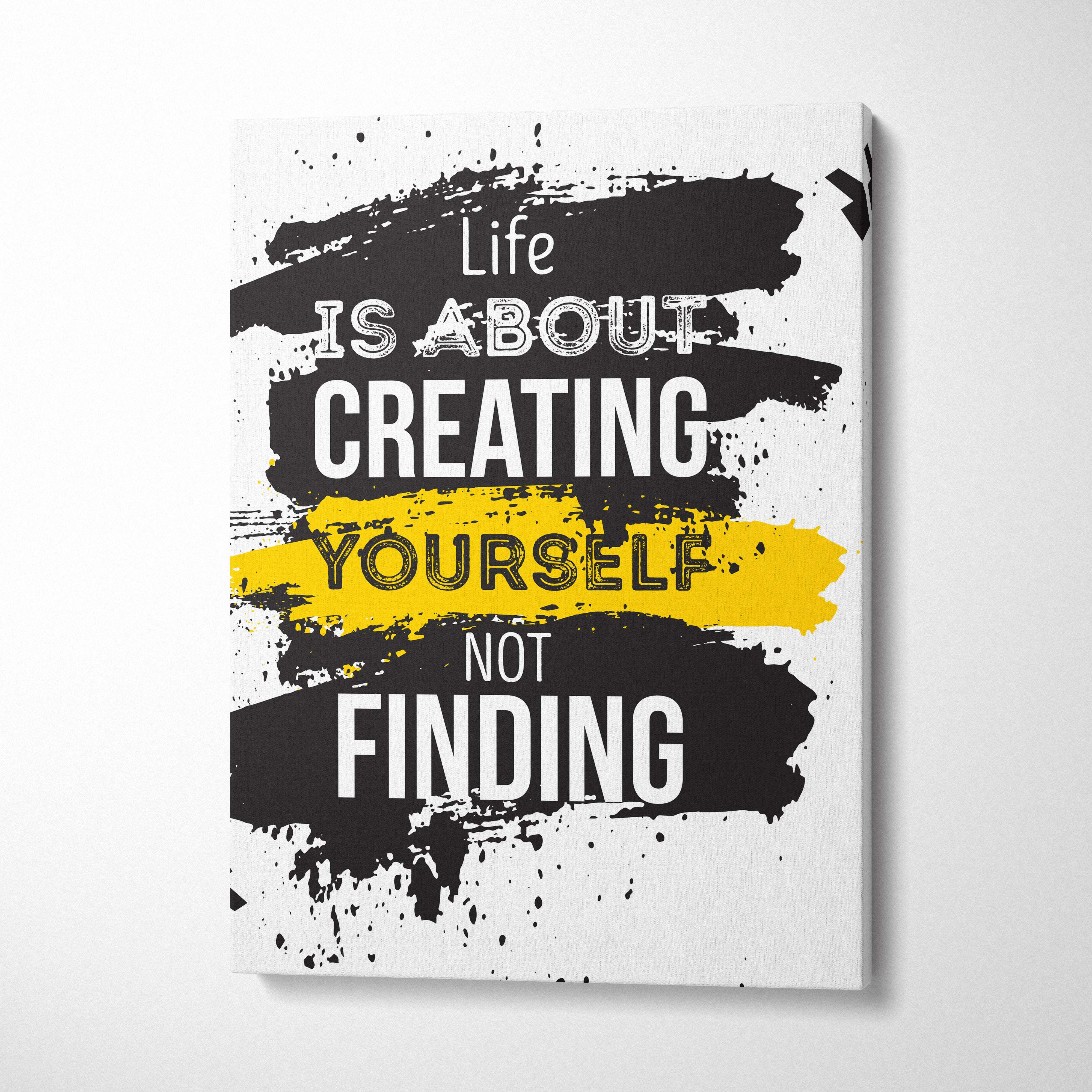 Black and yellow abstract canvas print with bold white text life is about creating yourself not finding for motivational decor