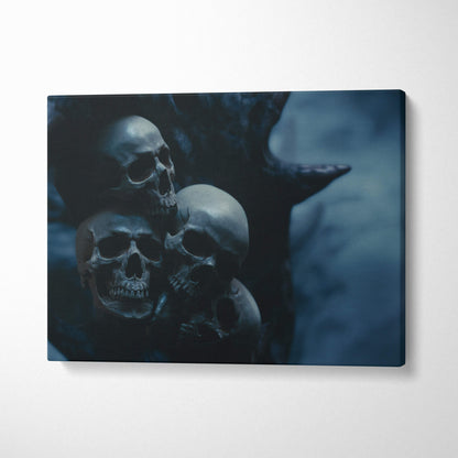 Dark blue canvas wall art print featuring three detailed human skulls for gothic halloween or moody bedroom decor