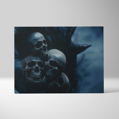 Dark blue rectangular canvas wall art print featuring a moody image of three stacked skulls with tree silhouette for gothic decor