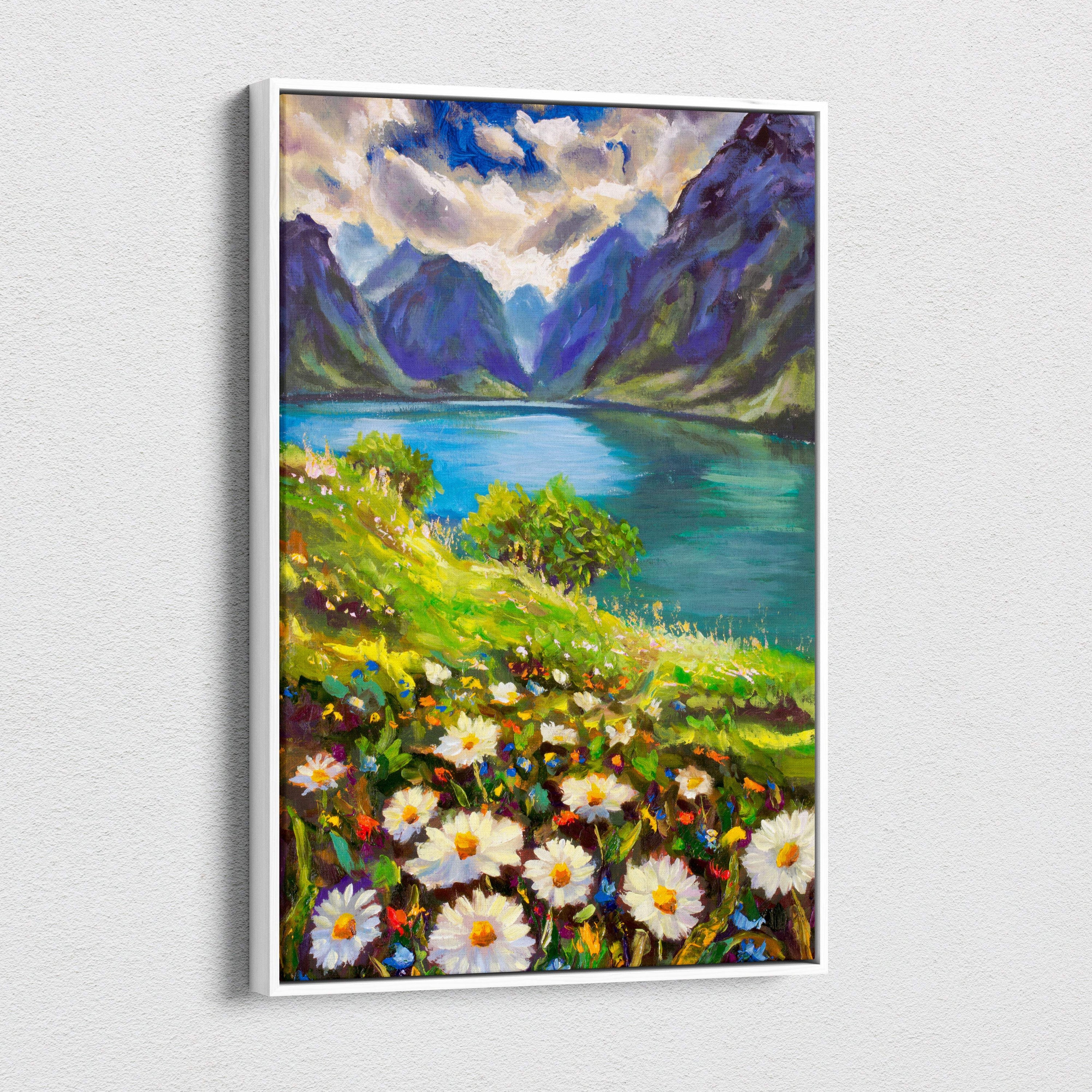 A framed canvas print of a vibrant mountain lake landscape with white daisies lush green hills and purple mountains in oil style