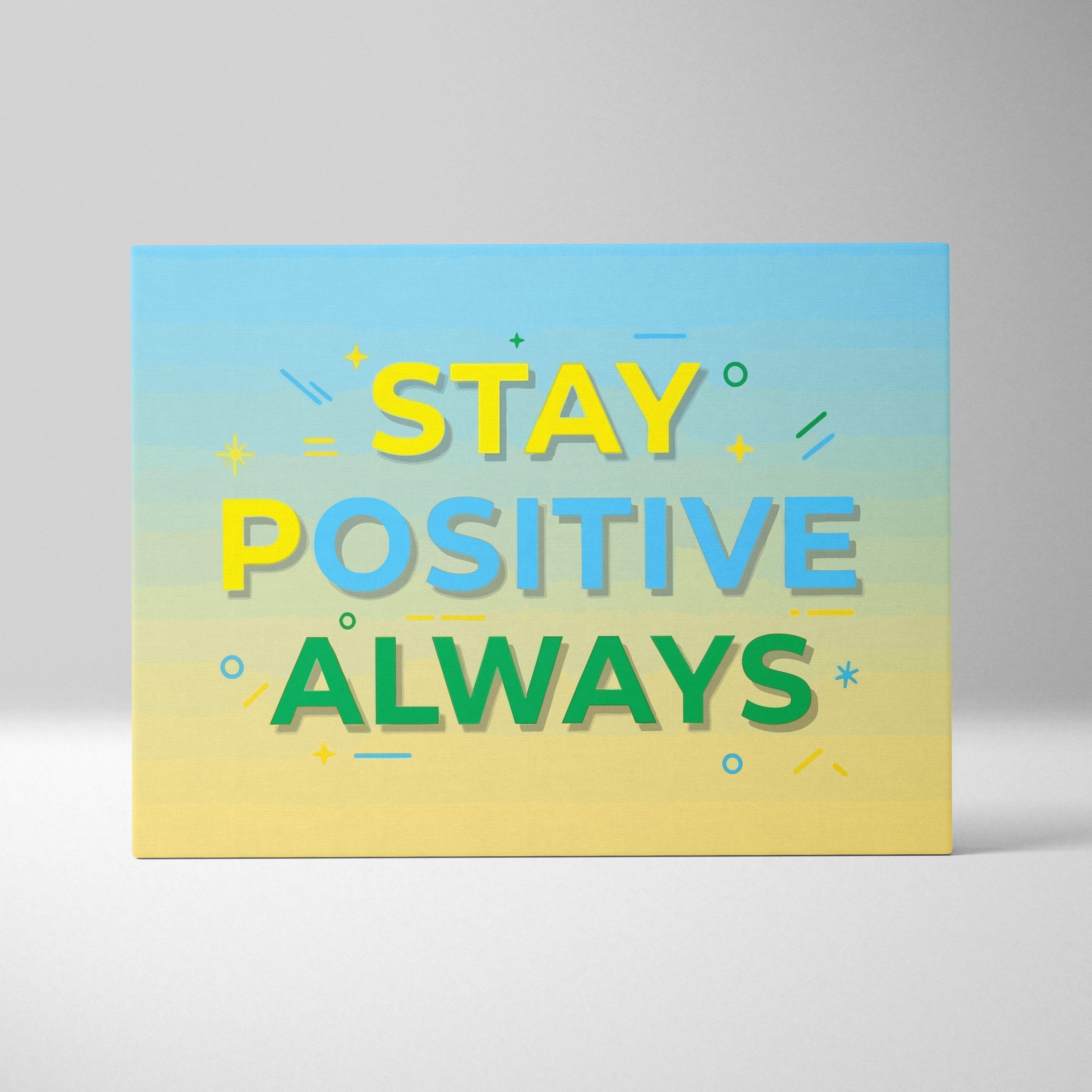 A rectangular canvas print with stay positive always colorful typography on a light blue to yellow gradient background