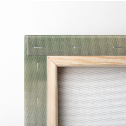 Olive green canvas stretched over light wood frame with stitching on rustic countryside painting style wall art back side